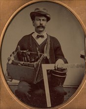 Carpenter Holding a Bag of Tools and a Square, 1880-90s.