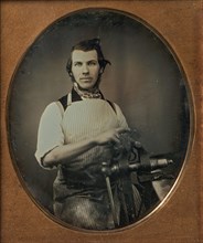 Metalworker in Apron Working with a Vise, 1840s-50s.