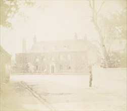 Man in Courtyard Before House, 1850s.