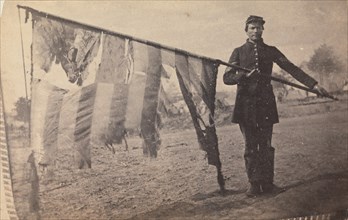 Sergeant Alex Rogers with Battle Flag, Eighty-third Pennsylvania Volunteers, Third Brigade, First Division, Fifth Corps, Army of the Potomac, ca. 1863.