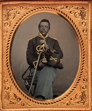 Union Cavalry Officer Displaying Sword, Holding Hat, Seated in Studio, 1861-65.