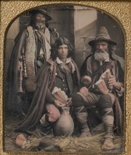 Three Men in Shepherd Attire, One with Bagpipes, the Other Two Holding Bread, 1850s.