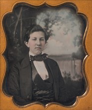 Young Man Seated in Front of Painted Outdoor Backdrop, 1850s.