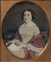 Seated Young Woman Wearing a Shawl, Holding an Open Book in her Lap, 1850s.