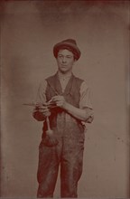 Painter Holding Palette and Brushes, 1870s.