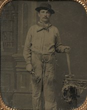 Workman Holding a Wrench and Hammer, 1860s.
