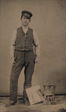 Tinsmith with Coal Heater and Sheet of Tin, 1870s-80s.