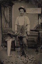 Carpenter or Cabinetmaker Standing Before a Sign Advertising His Trade, 1860s-80s.