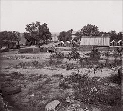 [View of a small town with wooden sheds in distance]. Brady album, p. 123, 1861-65. Formerly attributed to Mathew B. Brady.