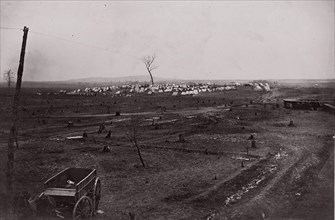 [Wagon in a landscape with army encampment in the distance]. Brady album, p. 125, 1861-65. Formerly attributed to Mathew B. Brady.