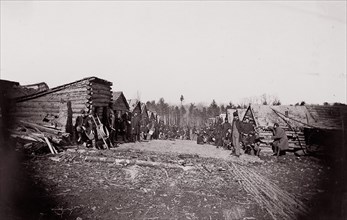 [Winter Quarters, troops with row of cabins]. Brady album, p. 128, 1861-65. Formerly attributed to Mathew B. Brady.