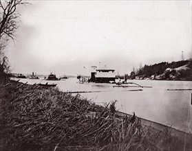 Ironclad fleet on James River below Rebel "Howlett House Battery", 1865. Formerly attributed to Mathew B. Brady