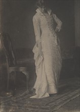 [Woman in White Laced-bodice Dress in Studio of Thomas Eakins], 1880s., 1880s. Creator: Thomas Eakins.