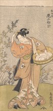 The Actor Onoya Matsusuke, in Female Robe of O-Kane, Adjusts the Comb in His Hair, 17..., 1735-1785. Creator: Torii Kiyomitsu.