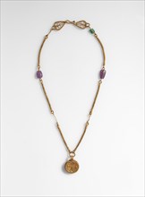 Gold Necklace with Gold Cross, Two Amethysts, and an Emerald Plasma, Byzantine, 6th-7th century.