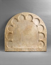 Tabletop, Byzantine, 400-600. Four sheep, representing the blessed according to Matthew 25:33-40, flank a Christogram,