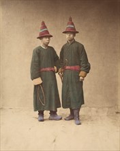 [Two Chinese Men in Matching Traditional Dress], 1870s.
