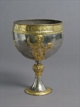 The Attarouthi Treasure - Chalice, Byzantine, 500-650. Saint holding a Gospel book. Inscribed in Greek.