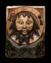 Plaque with the Head of Saint John the Baptist on a Charger, British, 15th century. This relief depicts the relic of John's head, which was kept in Amiens Cathedral.