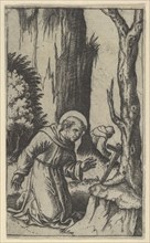 Saint Francis of Assisi praying before a crucifix