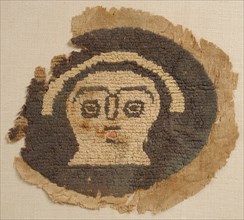 Roundel with Human Face, Coptic, 5th century.