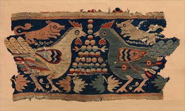 Fragment of Wall Hanging with confronted cocks and running dogs, Coptic, 4th-6th century.