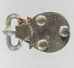 Belt Buckle, Frankish, about 600. With tiny face meant to represent Christ.