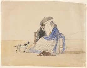 A Couple Seated on the Beach with Two Dogs