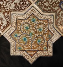Star-Shaped Tile, Iran, 13th-14th century. Waq-waq design of plant whose tendrils develop into heads of animals with text from the Shahnama in which Rustam, one of the tale?s great heroes, is engaged ...