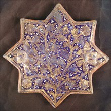 Star-Shaped Tile, Iran, second half 13th-14th century. Lajvardina Chinese-inspired lotus and peony blossoms adorning the walls of an Ilkhanid palace