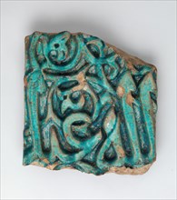 Fragment of a Glazed Tile Inscription, Iran, 12th-13th century. Three letters of the word "Allah,"