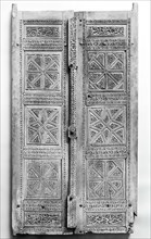 Pair of Carved Doors, Iran, dated A.H. [8]70/ A.D.1466. Teak doors with inscriptions in naskhi script with name of the patron, Davud ibn Ali Davud, and the artist, Ustad Muhammad,