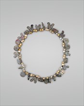 Necklace with Bird, Circle and Cylinder Beads, Iran, 11th-12th century.