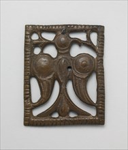 Appliqué Plaque with a Standing Eagle, Iran, 12th century. Perhaps ornamenting leather horse trappings or a belt.