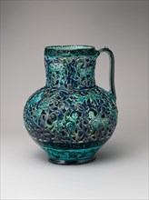 Pierced Jug with Harpies and Sphinxes, Iran, dated A.H. 612/ A.D. 1215-16. Verses around the rim were written by the poet Rukn al-Din Qummi,