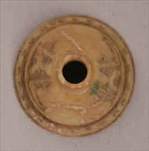 Spindle Whorl, Iran, 9th-10th century. With two stylized inscriptions, possibly undeciphered Kufic. Excavated at Nishapur, providing evidence the city possessed a thriving textile industry