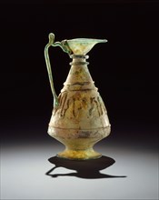 Small Glass Ewer, Iran, 11th century. Relief-cut