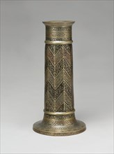 Engraved Lamp Stand with Chevron Pattern, Iran, dated A.H. 986/ A.D. 1578-79. Lyrical verses from the Bustan (Orchard) of Sa'di