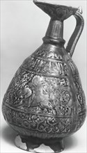 Ewer with Molded Inscriptions and Figures on Horseback, Iran, last quarter 11th-12th century.