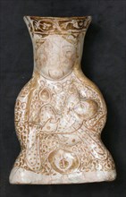 Hollow Vessel in the Shape of a Woman Holding a Child, Iran, 12th-13th century.