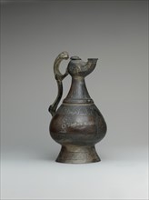 Ewer with Lamp-Shaped Spout, Iran, late 12th century. Arabic inscriptions of good wishes to the owner.