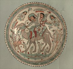 Bowl, Iran, 12th-13th century. Bahram Gur, riding a camel with one of his slaves, Azadeh playing a harp.
