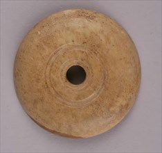 Spindle Whorl, Iran, 9th-10th century.  Excavated at Nishapur, providing evidence the city possessed a thriving textile industry.