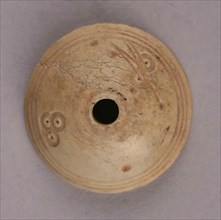 Spindle Whorl, Iran, 9th-10th century.  Excavated at Nishapur, providing evidence the city possessed a thriving textile industry