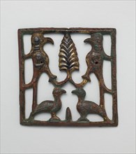 Appliqué Plaque with a Tree and Four Birds, Iran or Iraq, 12th century.