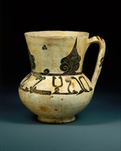 Ewer with Arabic proverb, "Devotion fortifies action", Iran or present-day Uzbekistan, 10th century. inscription in Kufic script "devotion fortifies action".