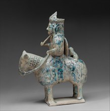 Mounted Hunter with Cheetah, Jazira (or Iran?), 12th-early 13th century. Cheetah rising was a traditional leisure pursuit of royalty and the wealthy elite