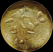 Plate with an archer hunting lion, ca. 250-ca. 650. Found in the collection of National Museum of Iran, Tehran.