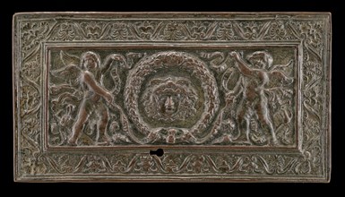Cover of a writing casket: Geniuses with Wreath and Medusa Head, c. 1500.