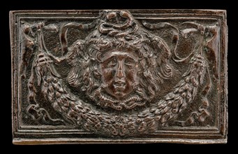 End panel of a writing casket: Medusa Head, Garland, and Bucrania, c. 1500.